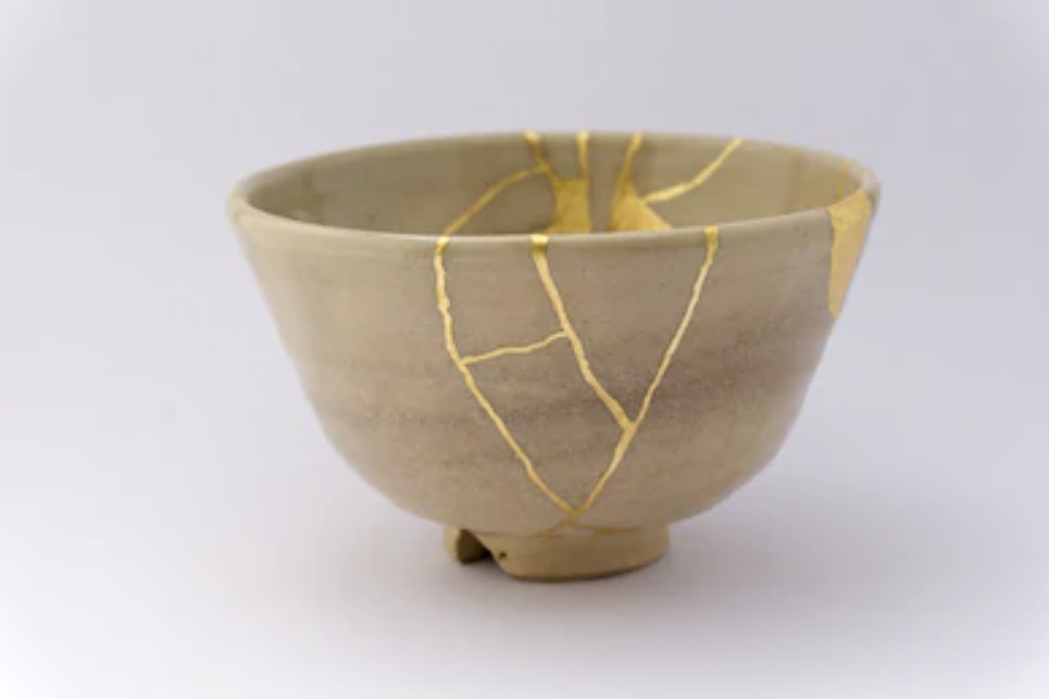 A ceramic bowl repaired with kintsugi technique A ceramic bowl repaired with kintsugi technique